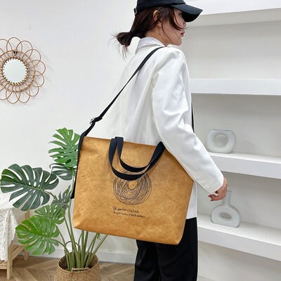 High-grade rubberized Dupont Paper Kraft Paper Bag Customized Tooth Bag Mass Handheld Personality Original Bag